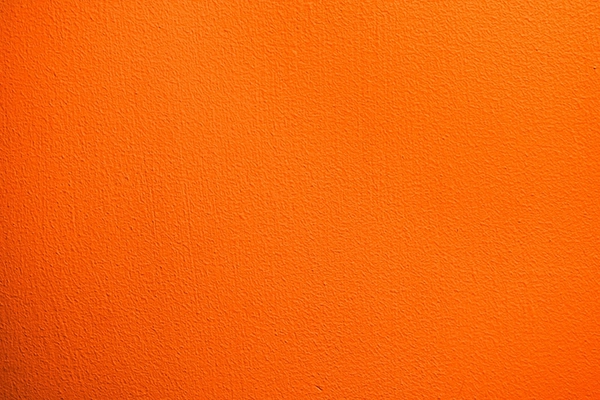 Orangene Wand mit Struktur